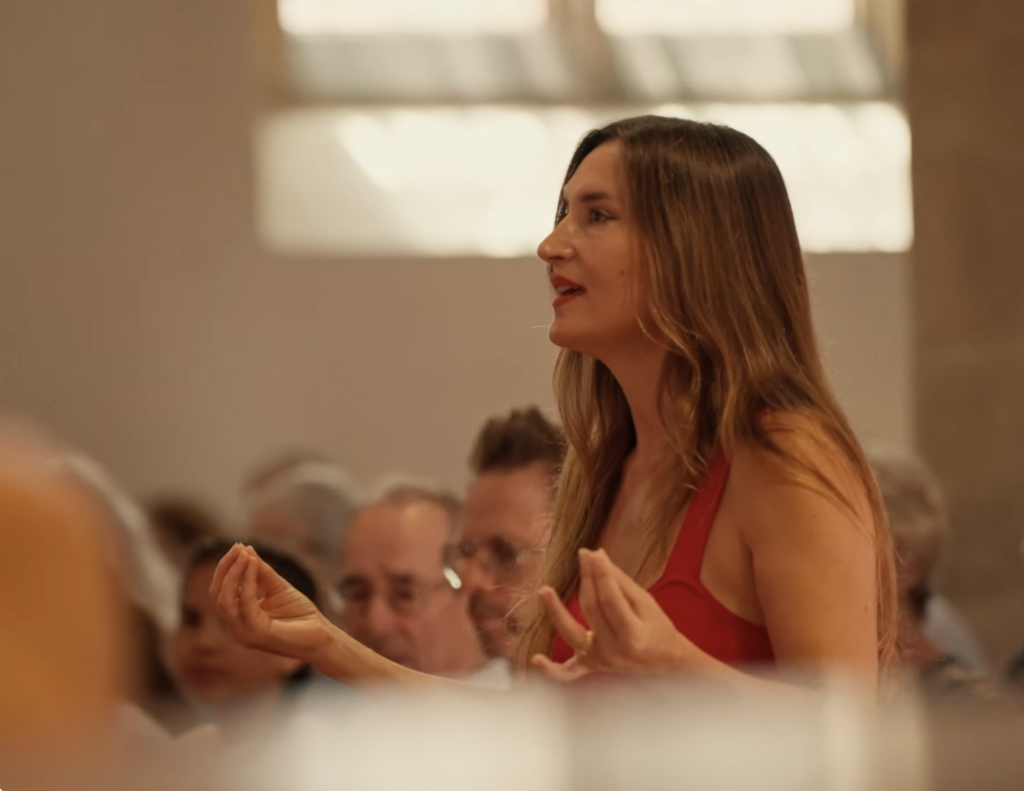 Christabel Heasman-Cossins leading a group singing workshop